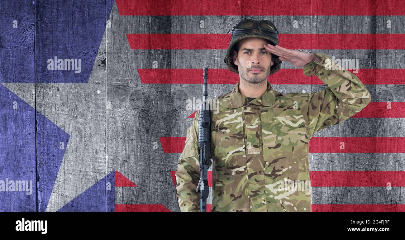 Composition of male soldier saluting over american flag Stock Photo - Alamy