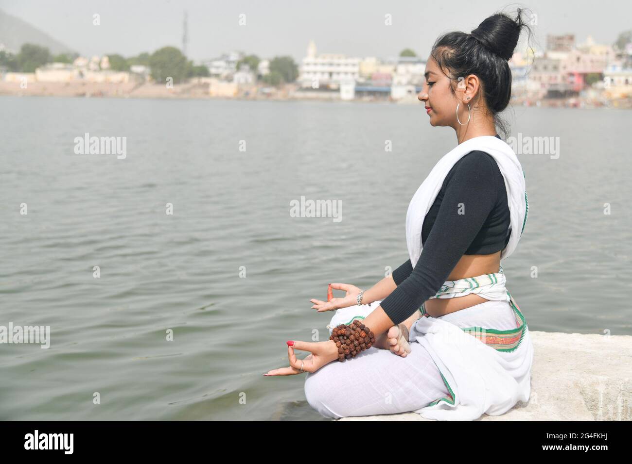 Pushkar, India. 21st June, 2021. Tejaswini Gautam perform Yoga on the occasion of International Yoga Day. (Photo by Shaukat Ahmed/Pacific Press) Credit: Pacific Press Media Production Corp./Alamy Live News Stock Photo
