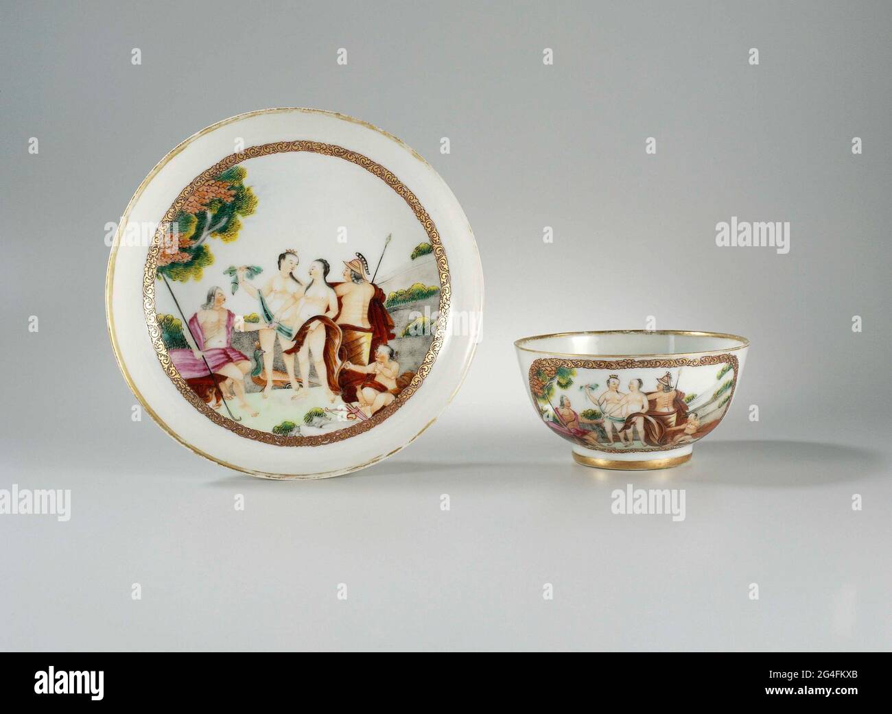 Cup and saucer of porcelain with straight wall, painted on the glaze in  blue, red, pink, green, yellow, black and gold. On the flat a medallion  with a representation of Paris