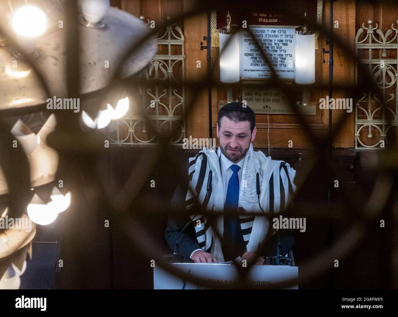 Leipzig Germany 21st June 21 Zsolt Balla State Rabbi Of Saxony Stands In The Synagogue With A Certificate Of Appointment And A Bag For A Travel Torah After His Induction Into The