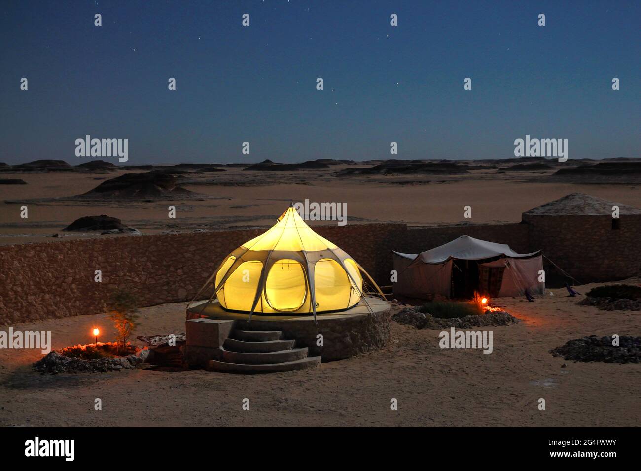 Bedouin camp during night in Siwa Oasis Sahara Desert. Credit: Dimitris Aspiotis / Alamy Stock Photo