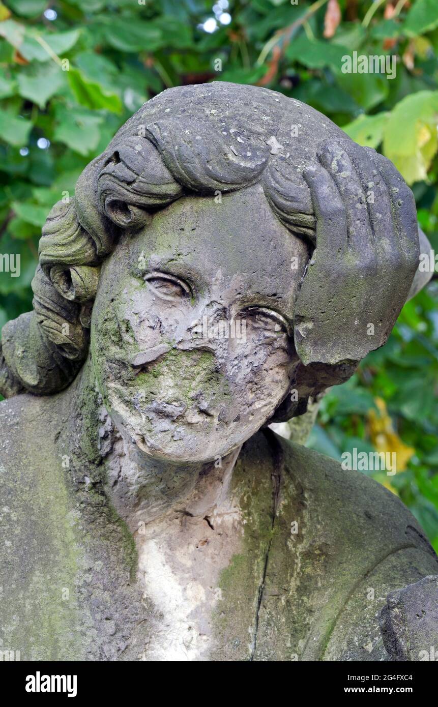 Angel without face and hand detail of a damaged statue in the old cemetery around 1860 Stock