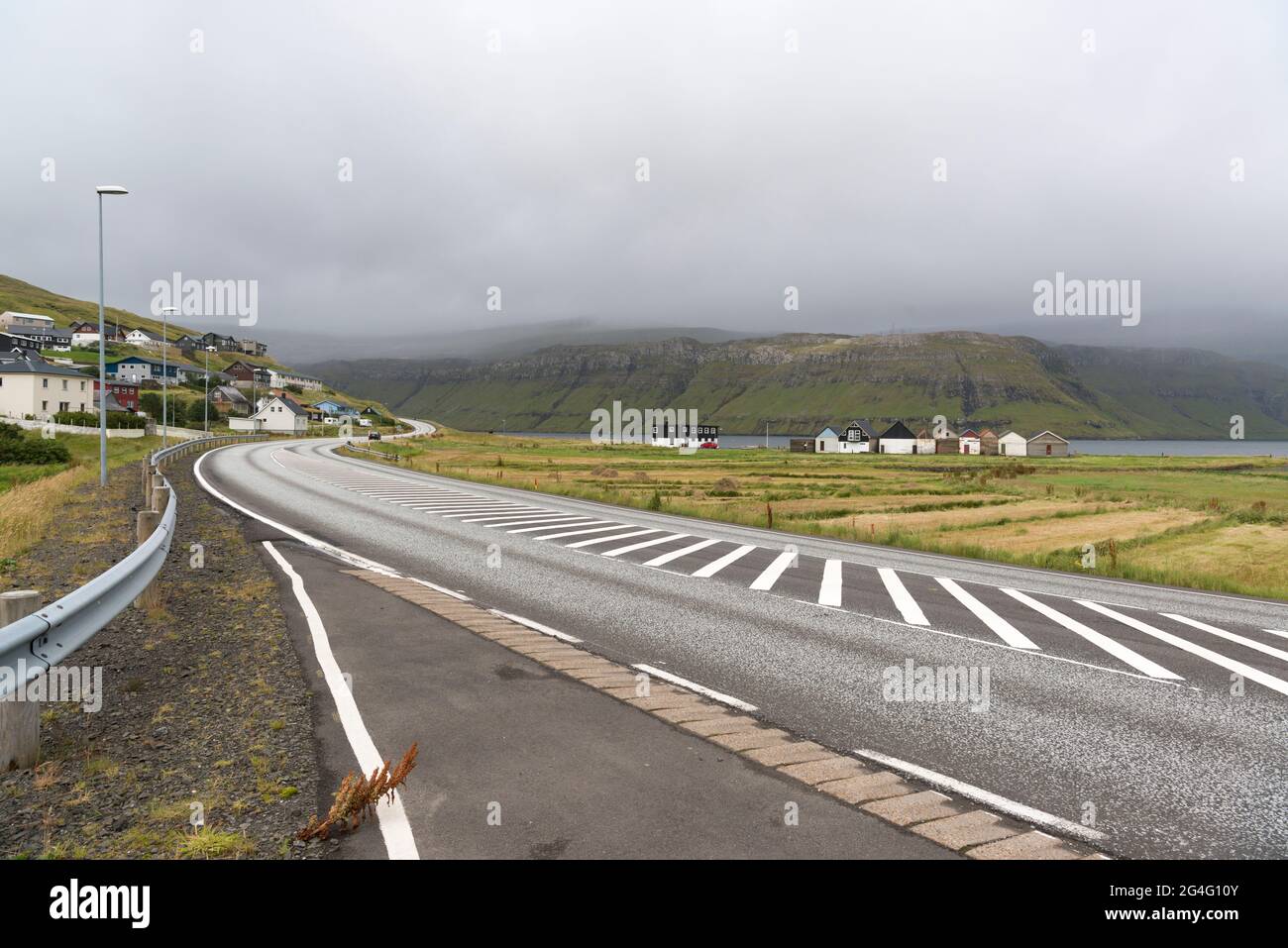 The village of Oyrarbakki on the Faroe Island of Streymoy, looking towards Esturoy, Faroe Islands Stock Photo