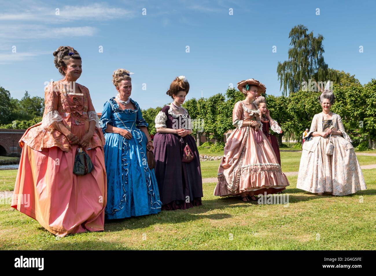 Auning, Denmark - 19 June 2021: 18th century day at Gammel Estrup Castle, People are dressed as in the 18th century and everything passes as then. Wom Stock Photo