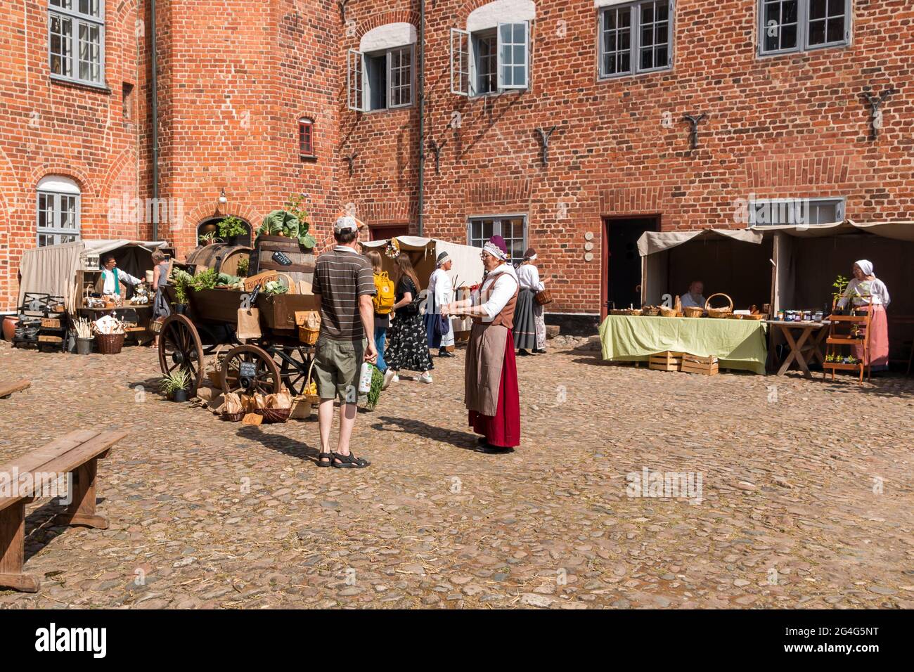 Auning, Denmark - 19 June 2021: 18th century day at Gammel Estrup Castle, People are dressed as in the 18th century and everything passes as then. Bea Stock Photo