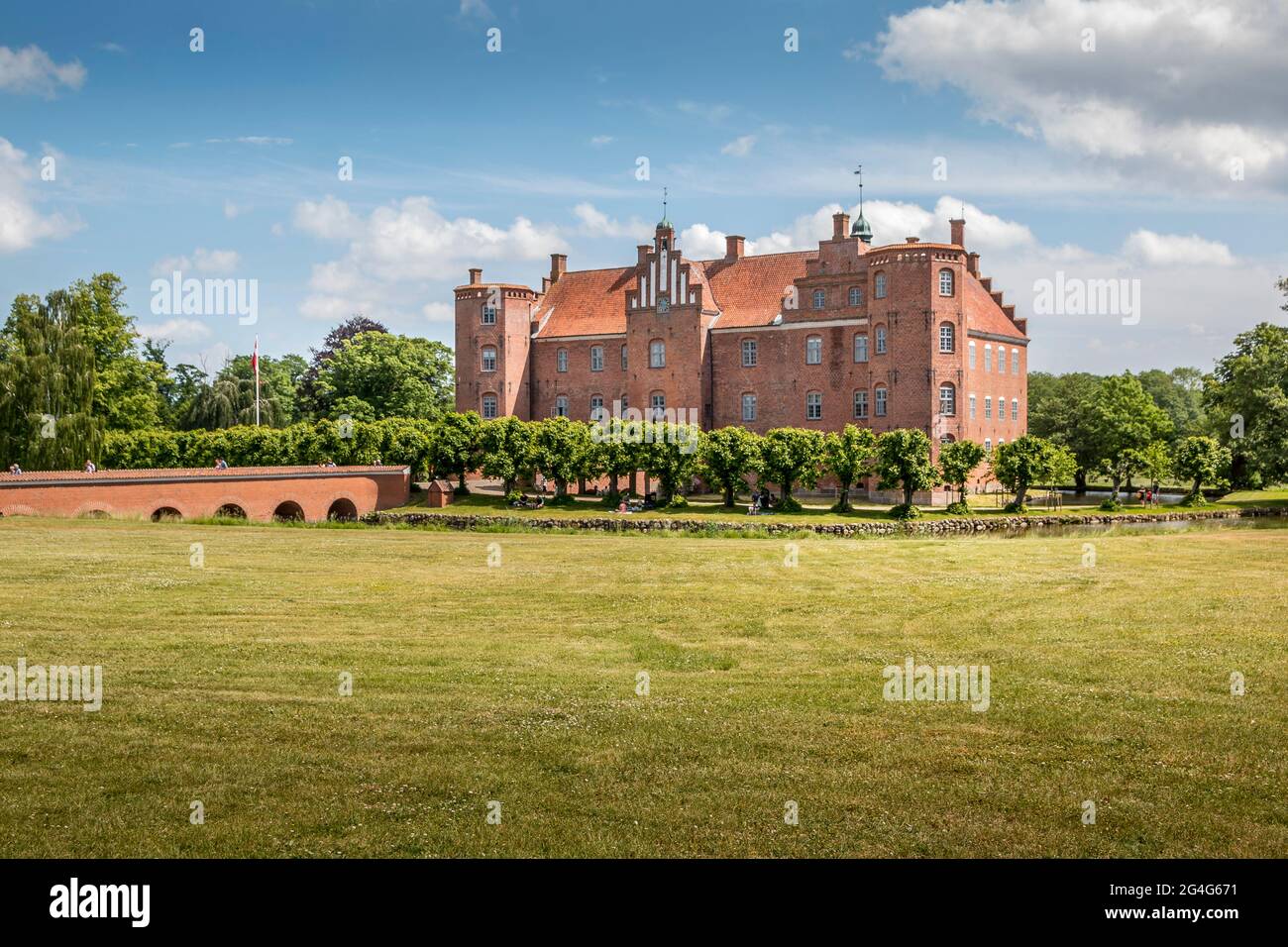 Auning, - 19 June 2021: Gammel Estrup Castle from the 14th century, The castle is surrounded by nature, trees and lakes and moat Stock Photo - Alamy