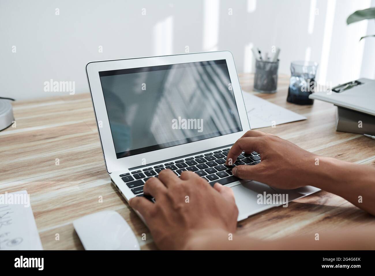 Hands of programmer coding on laptop at home or testing new program Stock Photo