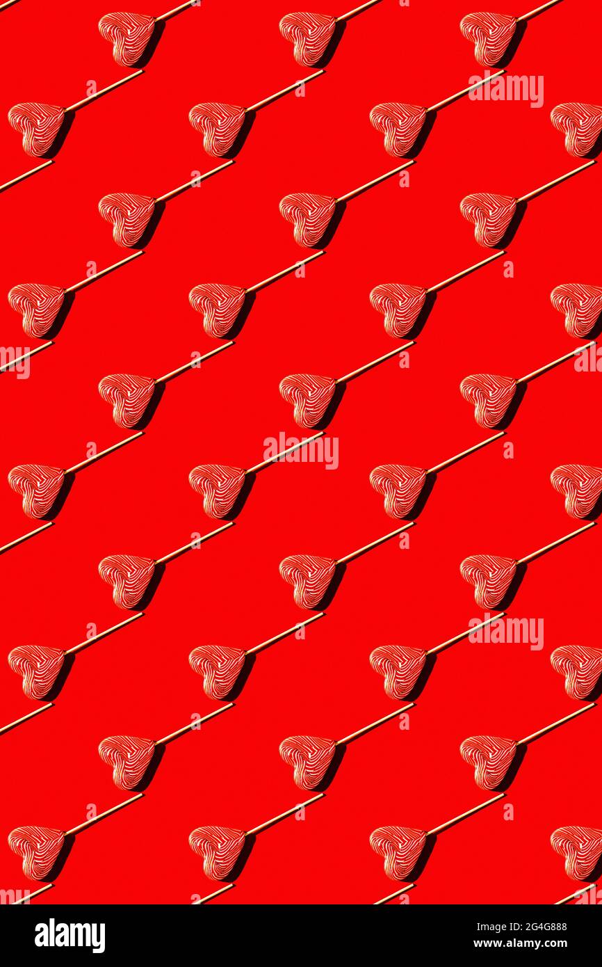 Lollipop heart shaped candy pattern, top view. Stock Photo