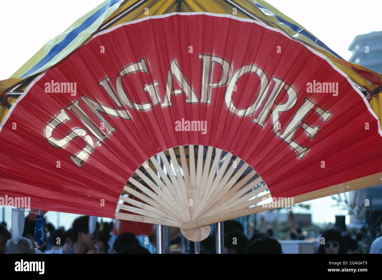 Singapore. Outdoor café restaurant gazebo. Sign on large Chinese fan. Stock Photo