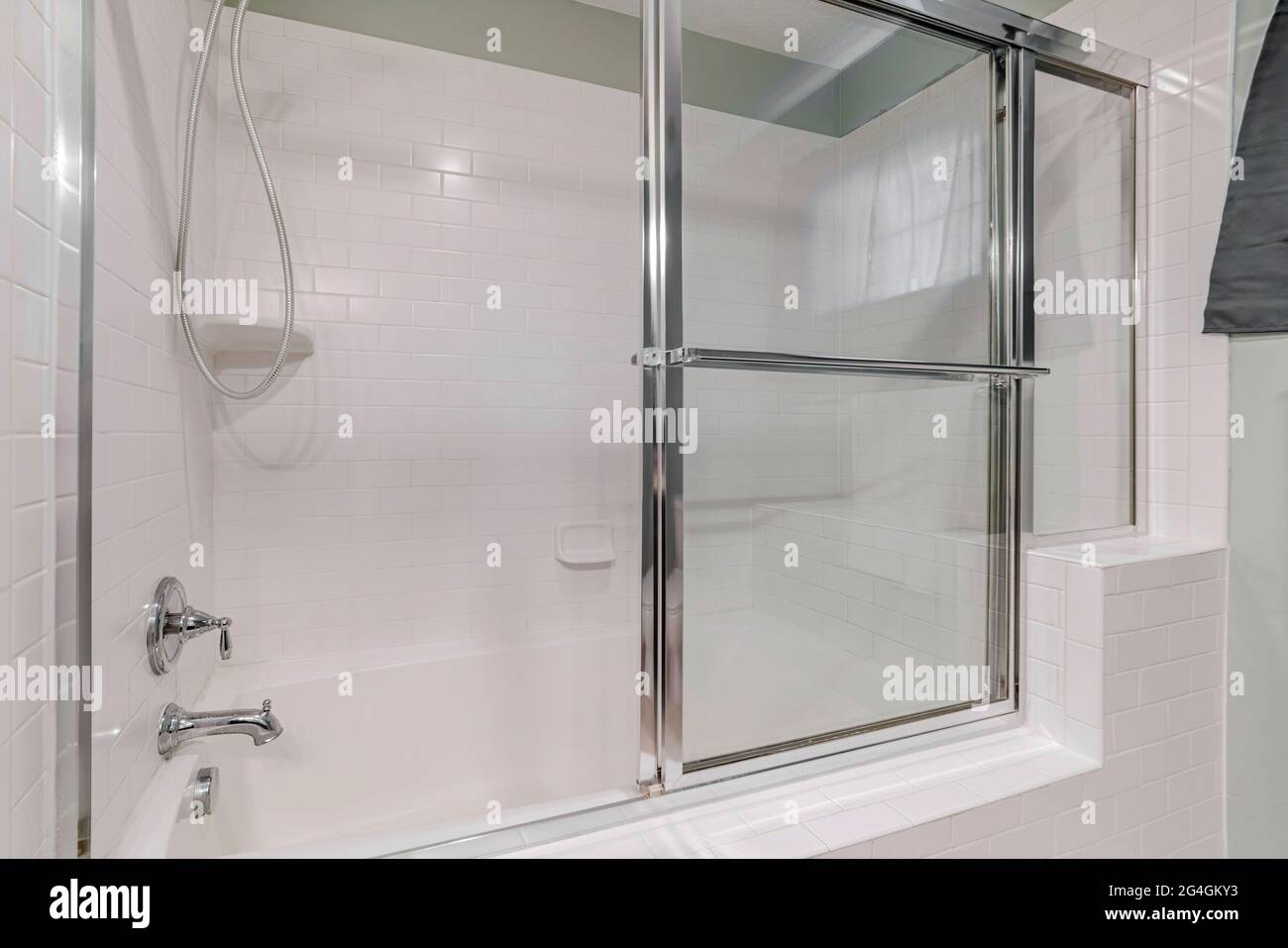 A modern style enclosed bathtub with a shower Stock Photo - Alamy