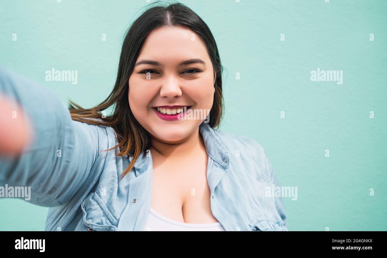 Plus size woman taking a selfie Stock Photo - Alamy