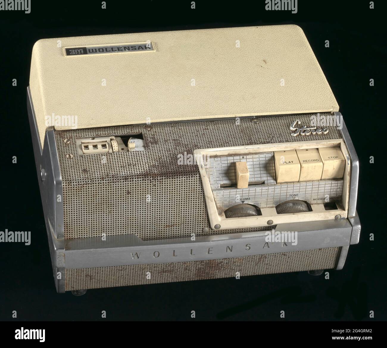 African-American Muslim minister and civil rights activist Malcolm X (born Malcolm Little, 1925-1965) gave speeches at Mosque No. 7, (later renamed Masjid Malcolm Shabazz) in Harlem, New York. Wollensak Stereo-tape magnetic recorder, Model T-1515. Beige plastic with silver metal. The front of the recorder has several beige buttons to play, record and stop as well as volume and tone controls. There is a counter to track the time of the recording to the left of the buttons. The lid of the recorder lifts off so that tape reels can be placed inside for recording. The lid of the recorder has the wo Stock Photo