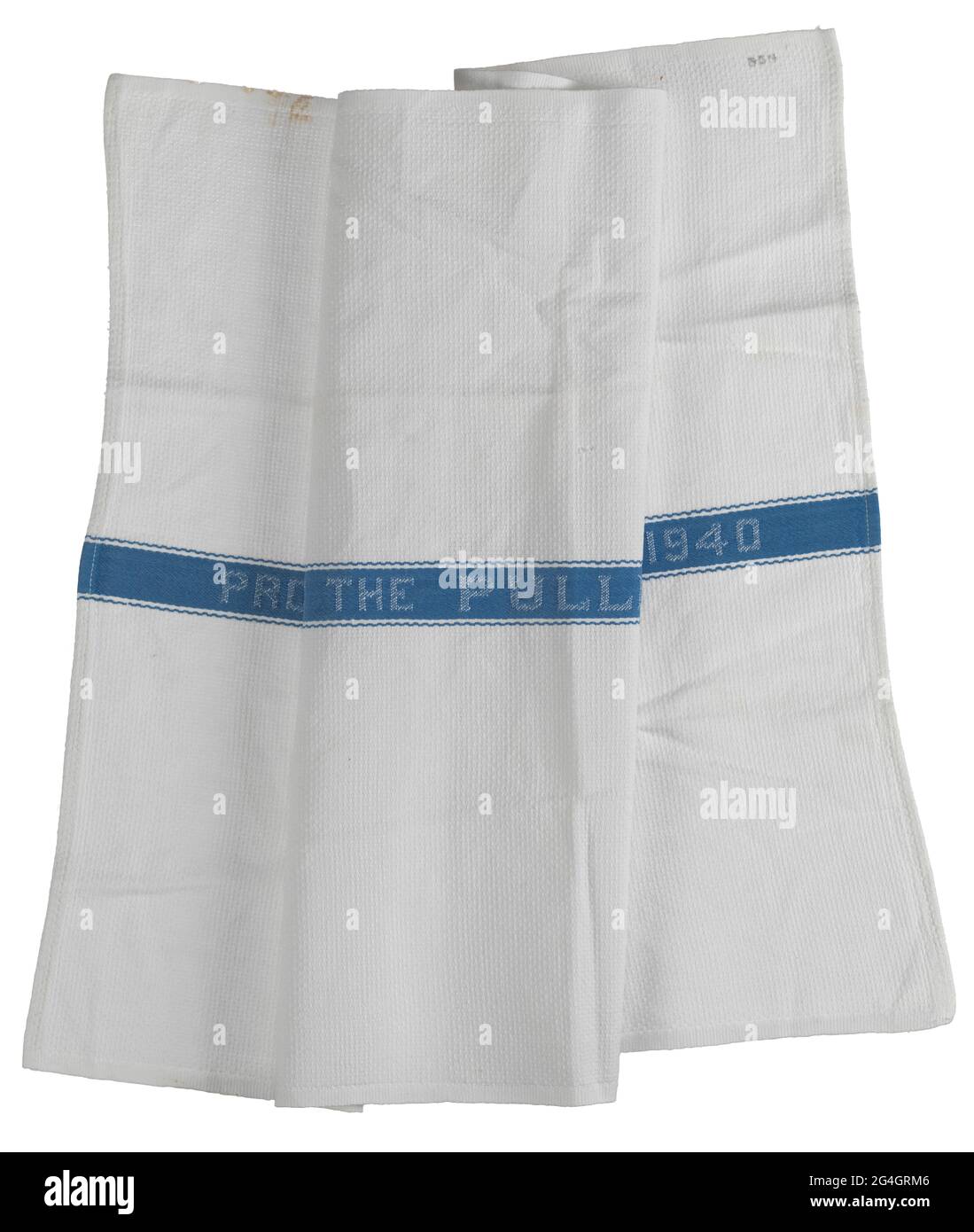White cotton with a small basket weave patterned rectangular Pullman Company towel. At the center of the towel is a blue fabric band with a small curved line decorative stitched boarder. Stitched in white thread at the center of the blue band is: &quot;PROPERTY OF THE PULLMAN COMPANY 1940&quot;. Stock Photo