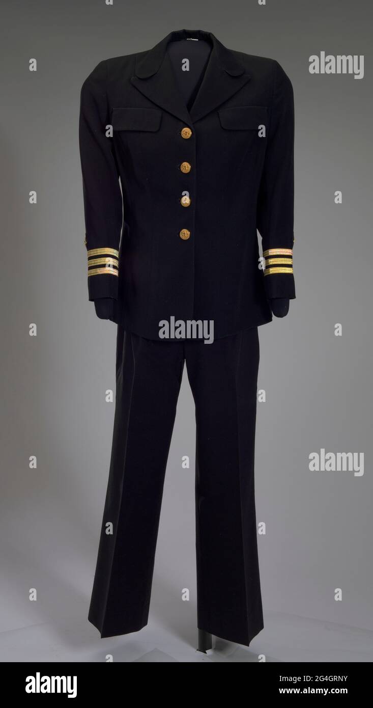 Four-star Admiral Michelle Howard (born 1960) was the first African-American woman to command a United States Navy ship. In 2014 she was appointed Vice Chief of Naval Operations, the second highest ranking officer in the US Navy. A US Navy women's dress uniform jacket worn by Admiral Michelle Howard as commander. The single-breasted jacket is made from black twill fabric and has a short slightly flared skirt with a straight cut hemline. It has a rounded collar with a notched lapel. Stock Photo