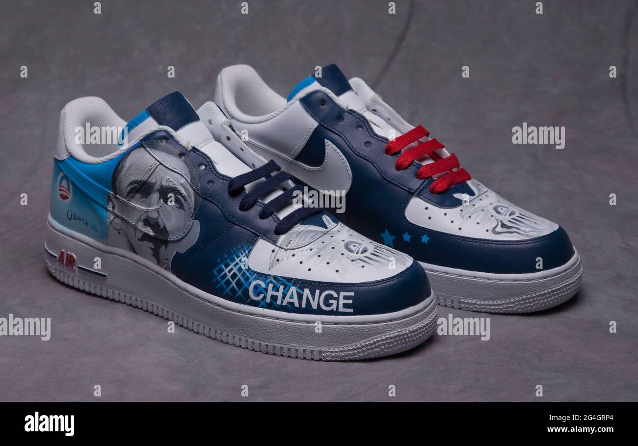 One pair of hand-painted sneakers featuring Barack Obama, first  African-American presiden of the USA, made during his presidential campaign.  The shoes are a pair of white basketball sneakers, Nike Air Force 1s,