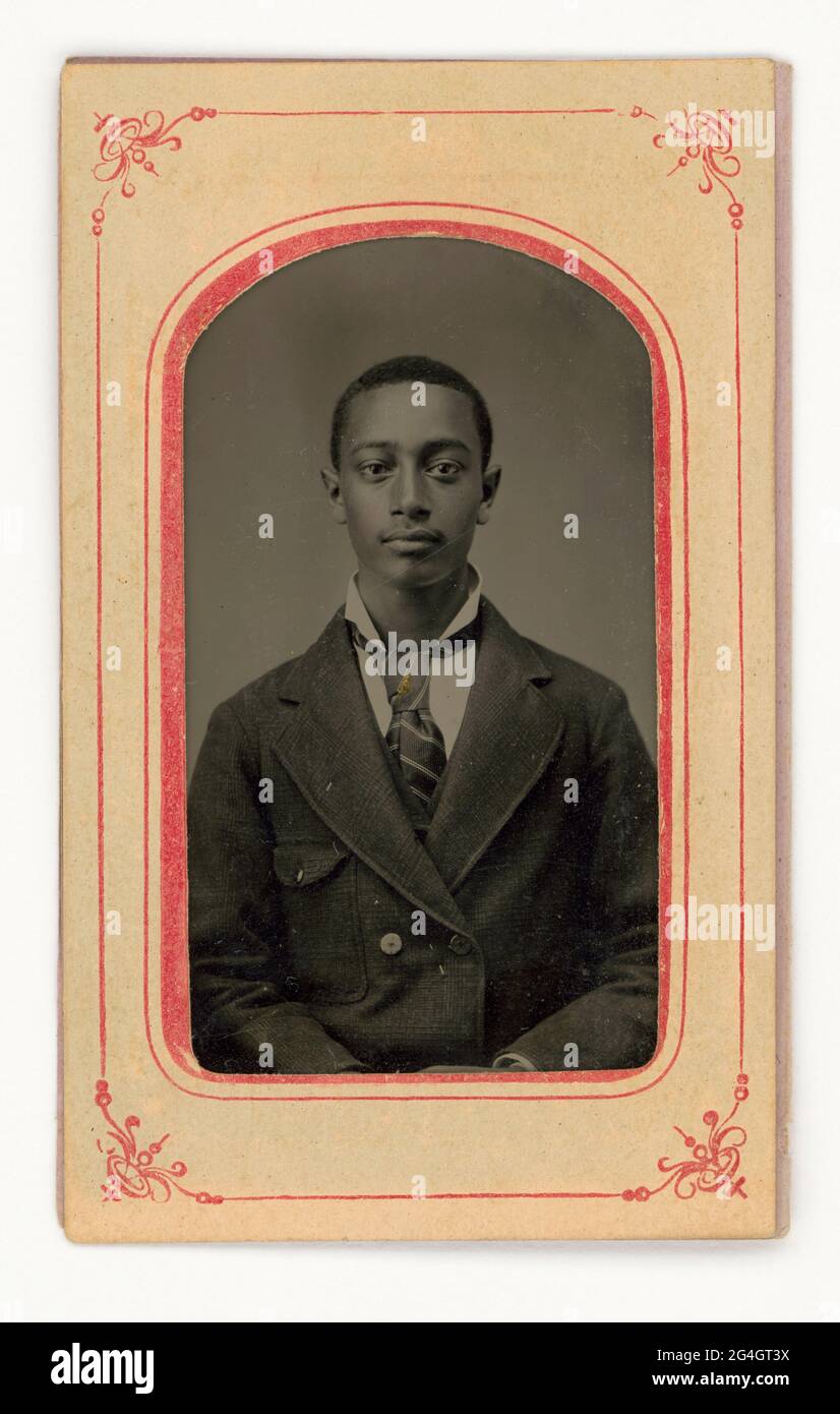 An unidentified African American man wearing a necktie, double