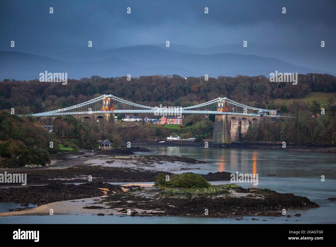 A winter’s view of Menai Bridge and the Menai Strait, Anglesey, North  Wales Stock Photo