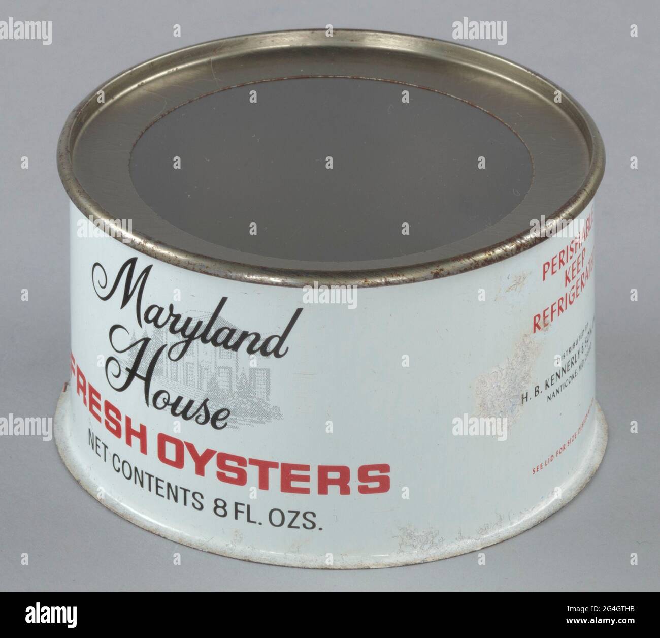 An eight ounce tin can for the Maryland House brand of oysters distributed  by H. B. Kennerly &amp; Son, Inc. The can is white with red and black text.  On the front