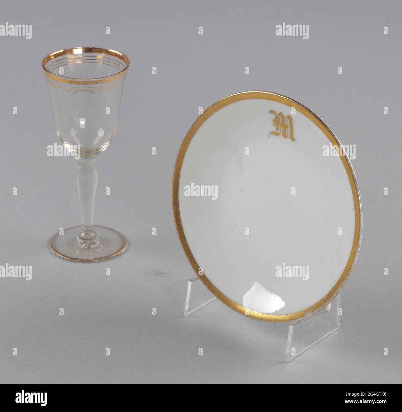 Glass stemware with gold decoration at rim of bowl and at base of stem