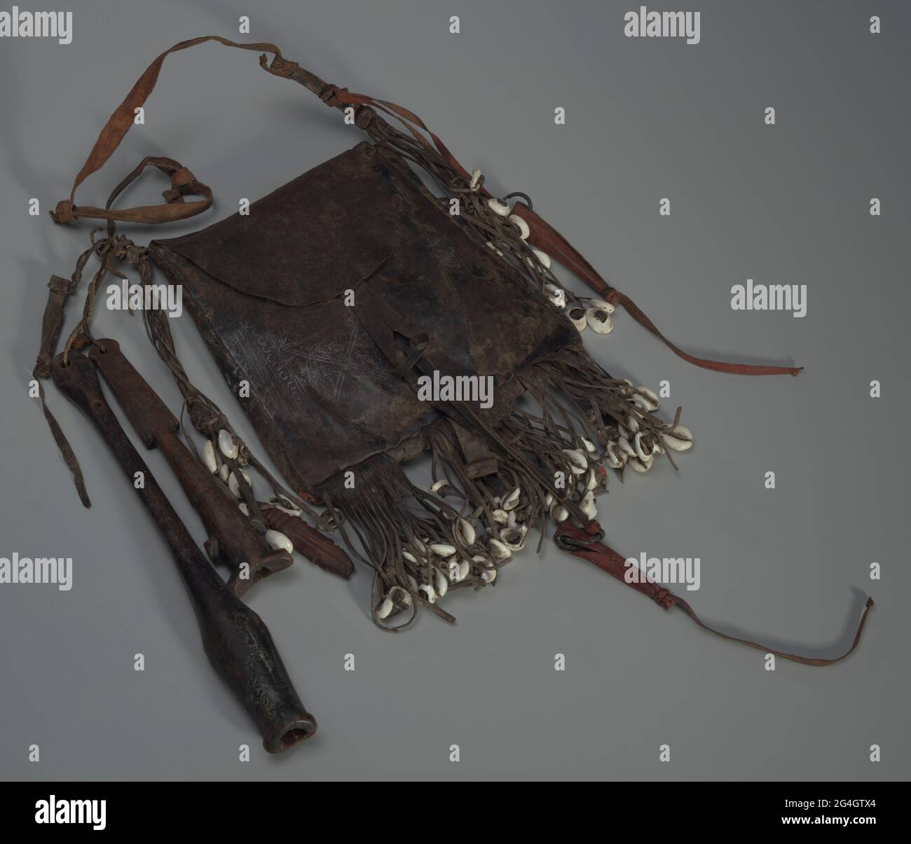 Leather with cowrie shells wood and iron hires stock photography and