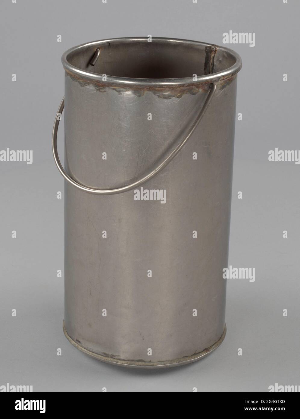 A cylindrical metal shucking bucket. The bucket has a welded seam along