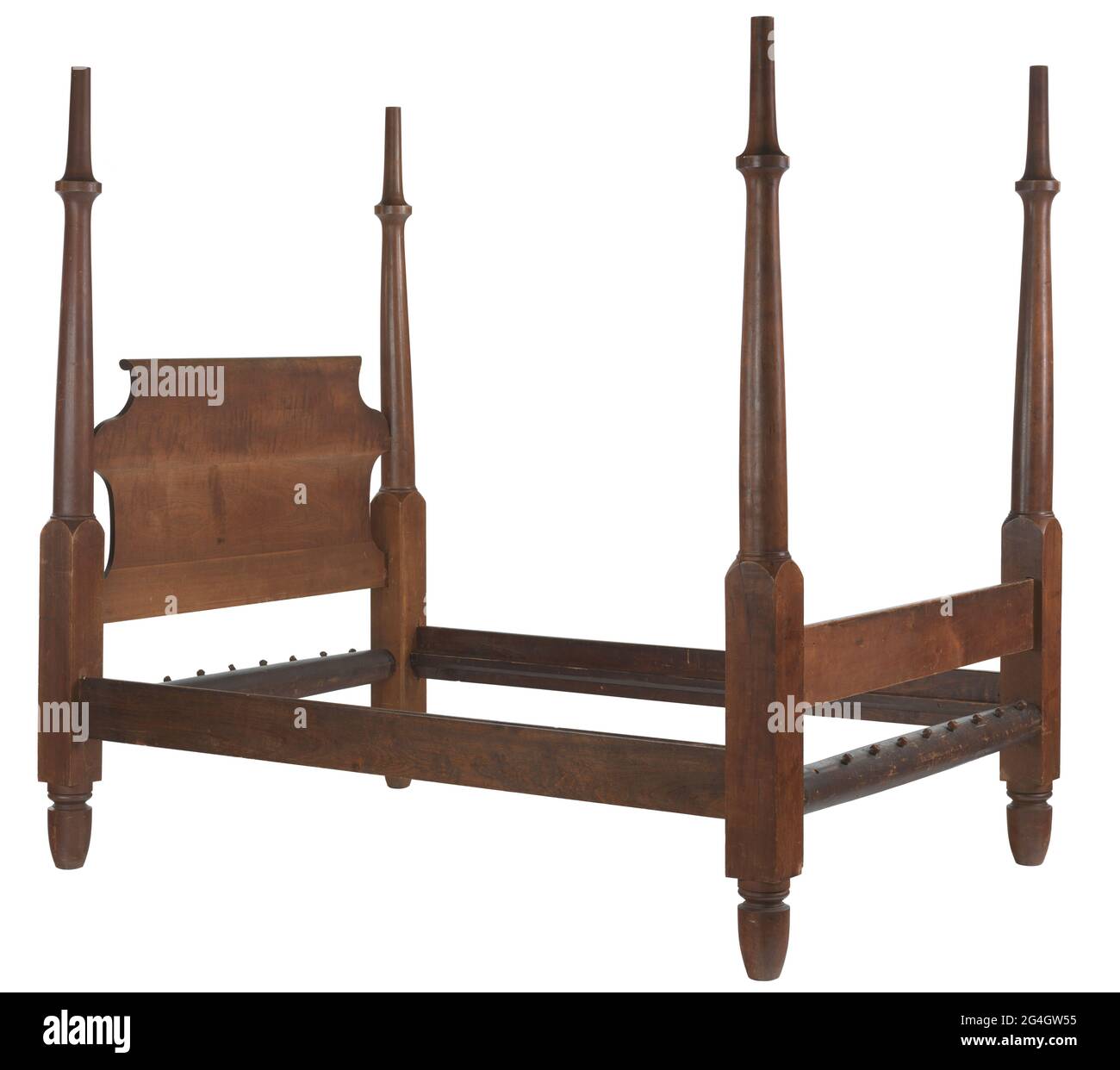 A wooden four poster bed frame with head board and foot board. The