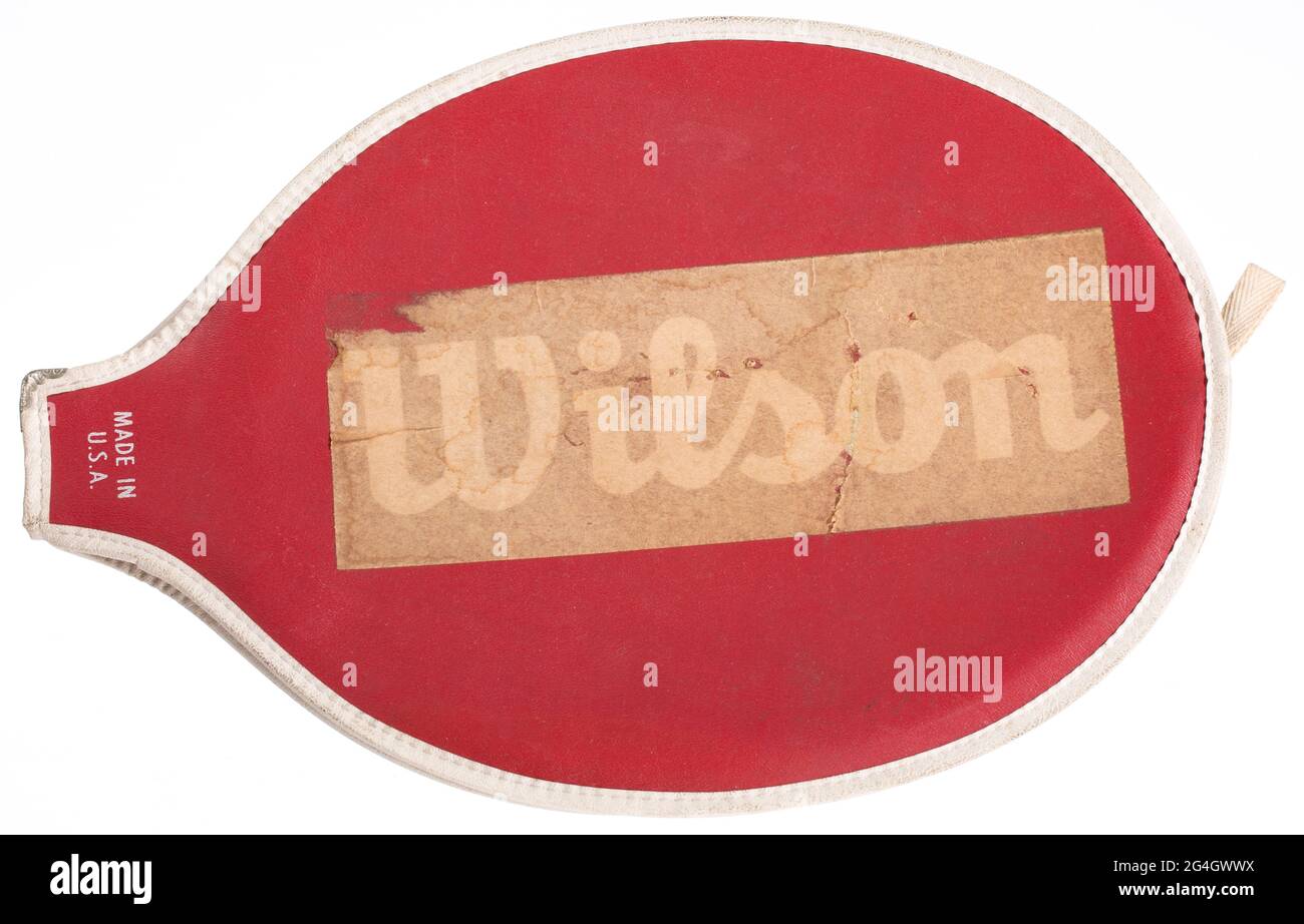 In 1956 Althea Gibson (1927-2003) became the first African-American to win a Grand Slam title (the French Championships). The following year she won both Wimbledon and the US Nationals. Red and white tennis racket cover. White type appears on center of either side reading, [Wilson]. The &quot;Wilson&quot; type has been covered with tape. White type near bottom of covering reads [MADE IN/U.S.A.]. Cover has zipper running along side of cover. Stock Photo