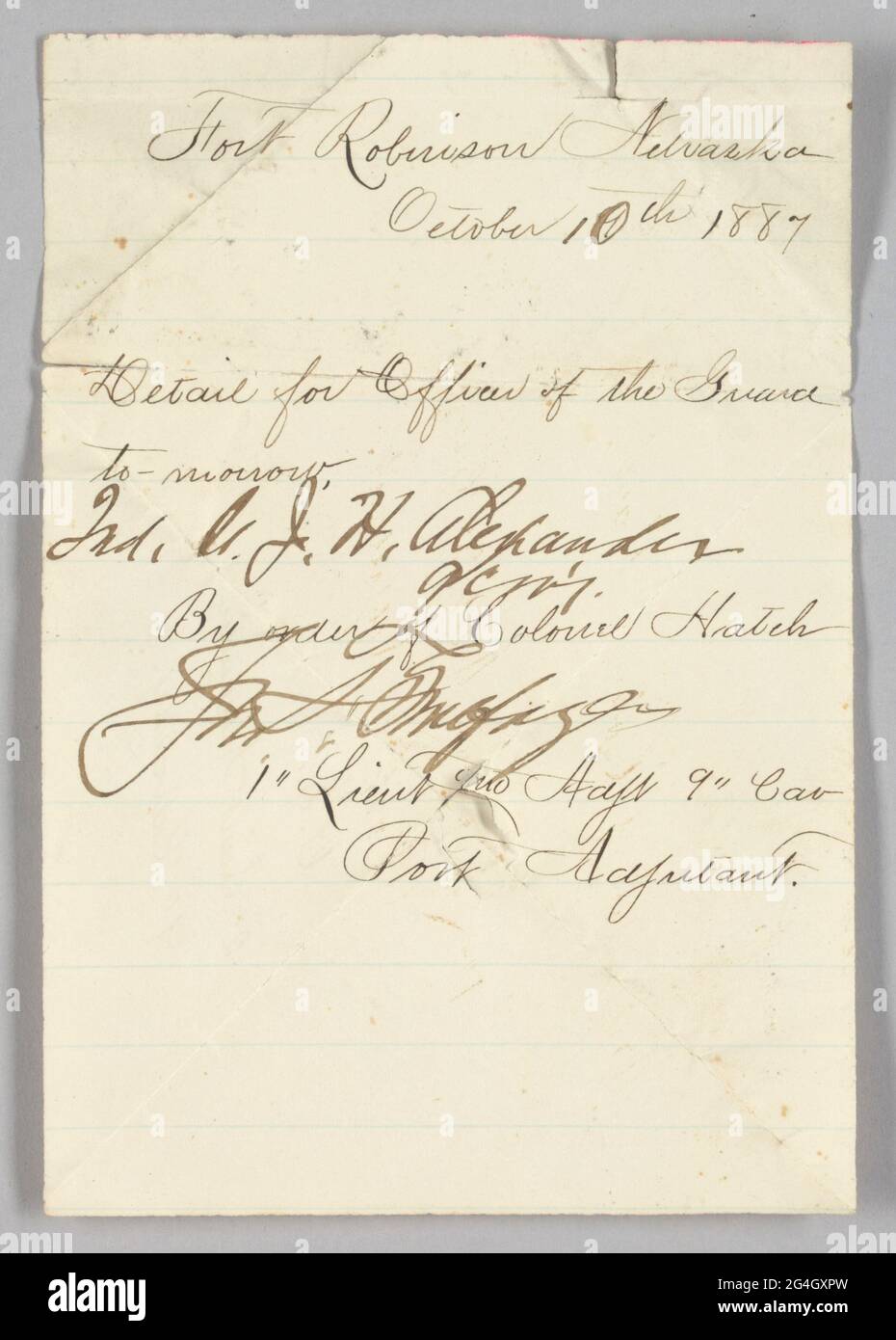Hand-written order issued to second lieutenant John Hanks Alexander to report for Officers of the Guard duty at Fort Robinson, Nebraska on October 10, 1887. The document was written by an unidentified first lieutenant by order of Colonel Edward Hatch. The document was written in black ink on white paper and has several creases. Both sides of the document have writing. Alexander was the first African-American officer in the United States armed forces to hold a regular command position. Stock Photo