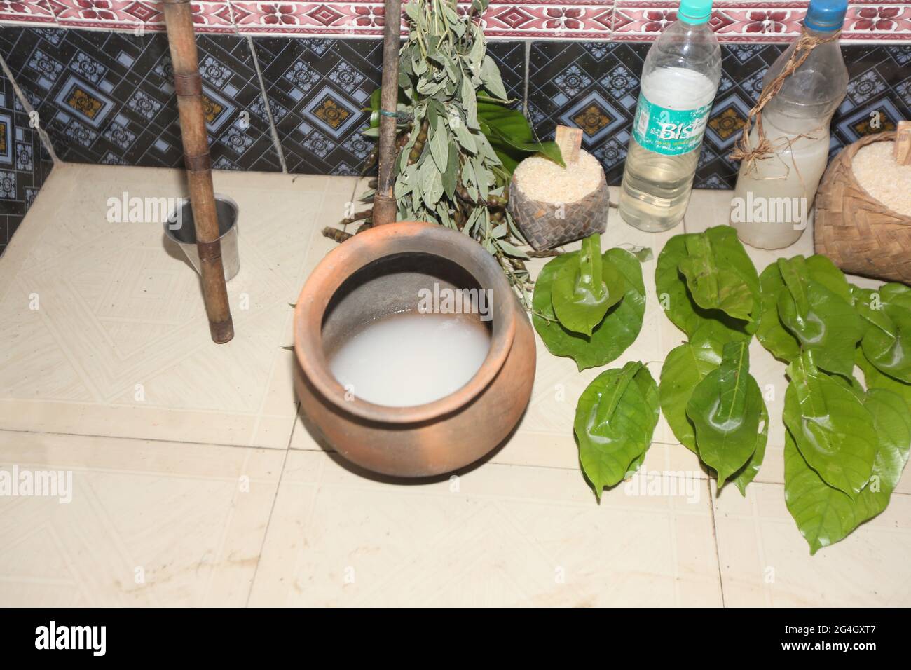 LANJIA SAORA TRIBE. Offering Tadi or toddy liquor in a mud bowl to Saora deities and Spirits is one of the ritual of Idital ceremony. Puttasingh villa Stock Photo