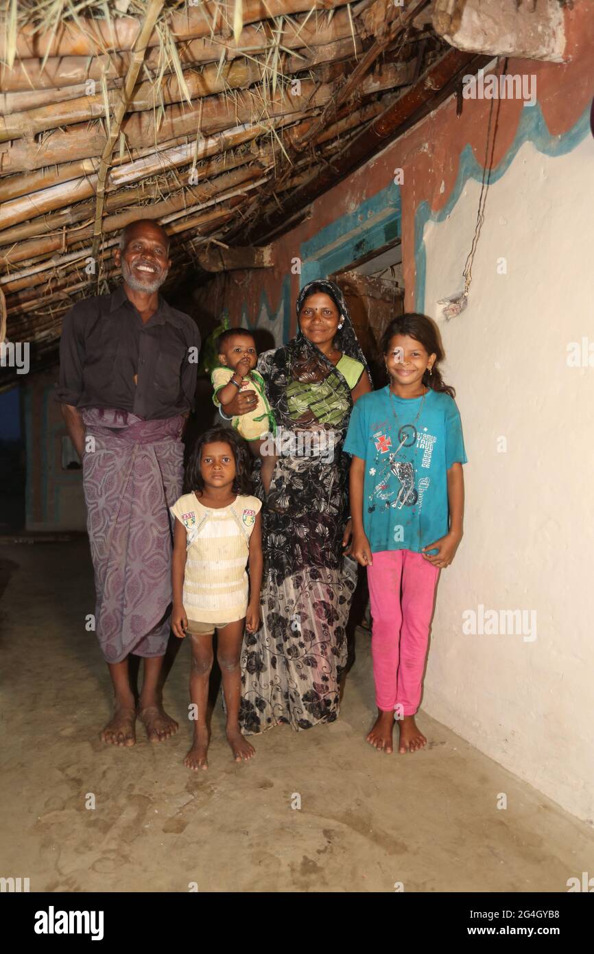KOL TRIBE. Family posing for picture inside their home. Bhanpur Village of Huzur Tehsil in Rewa Dist, Madhya Pradesh, India Stock Photo