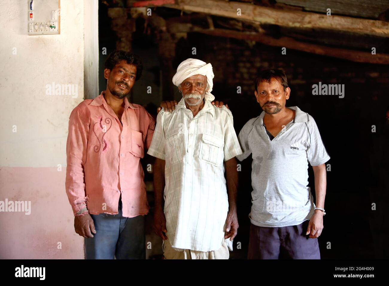 RATHAWA TRIBE - Tribal old man with his sons. This picture was clicked in Maraja village of Gujarat, India Stock Photo