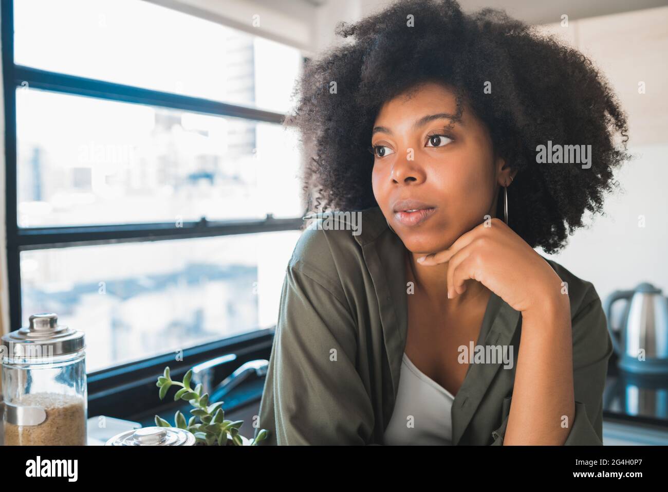 Afro woman relaxing at home. Stock Photo