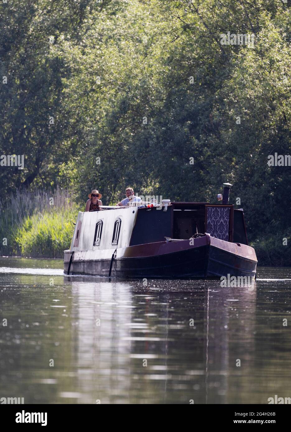 Canal boat UK; a canal boat on the river Thames at Wallingford seen in the early morning; River Thames, Oxfordshire UK Stock Photo