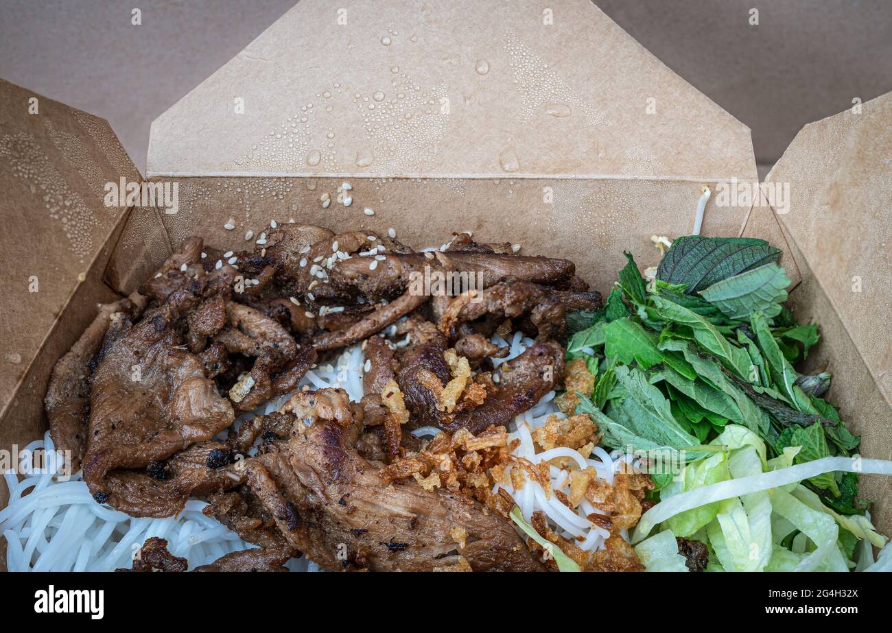 Vietnamese dish Bun Bo Nam Bo in a take out box - beef, noodles, bean sprouts and veggies Stock Photo