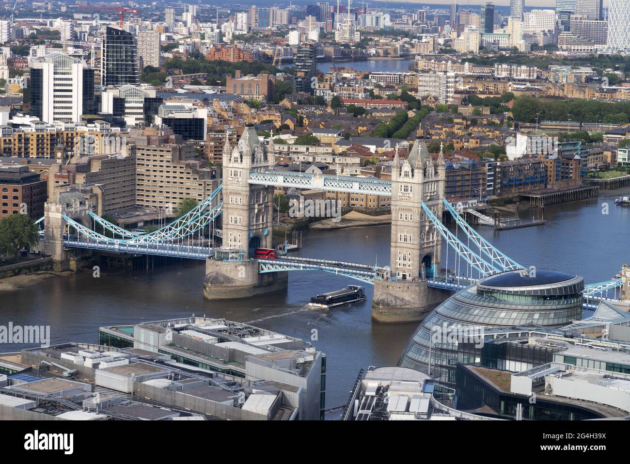 Tower Bridge London, with a boat going under it; - view from the Shard of Tower Bridge and the River Thames, London UK Stock Photo