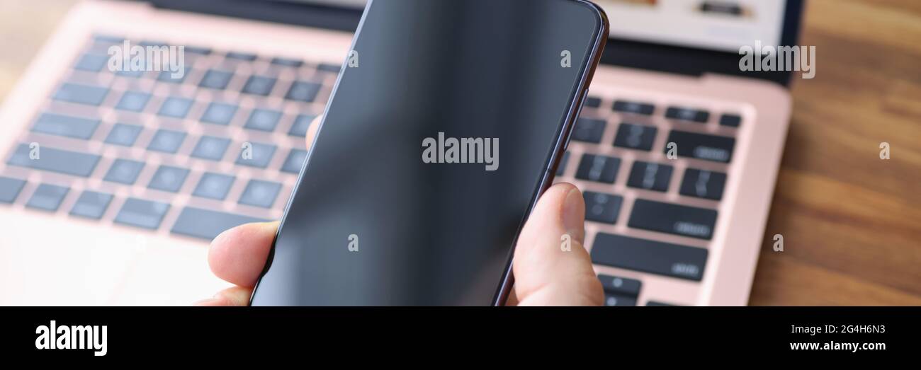 Male hand holding Samsung Galaxy S21 closeup Stock Photo