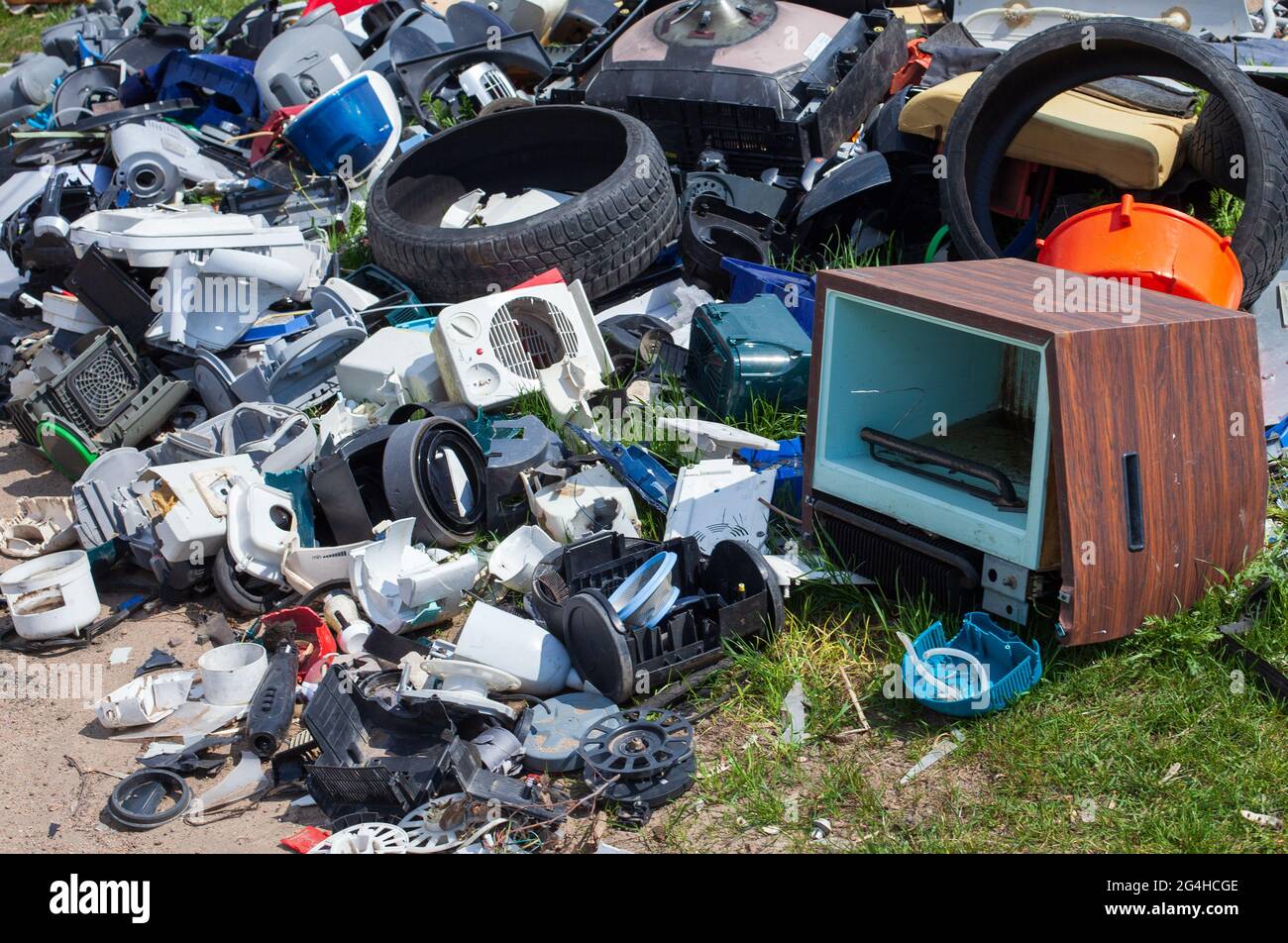 LESZNO, POLAND May 03, 2021 Illegal garbage dump among fields, by the road. Waste electronics