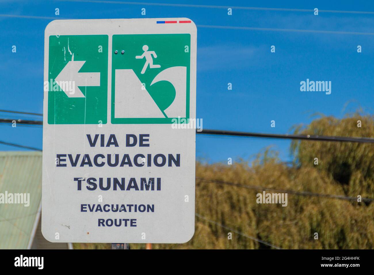 Tsunami Hazard Zone Sign in Achao village, Chile Stock Photo
