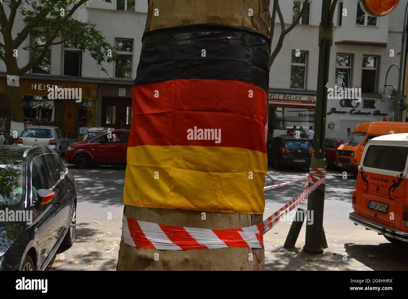 German flag hung on a tree at Rankestrasse in Berlin, Germany - 21st June 2021 Stock Photo
