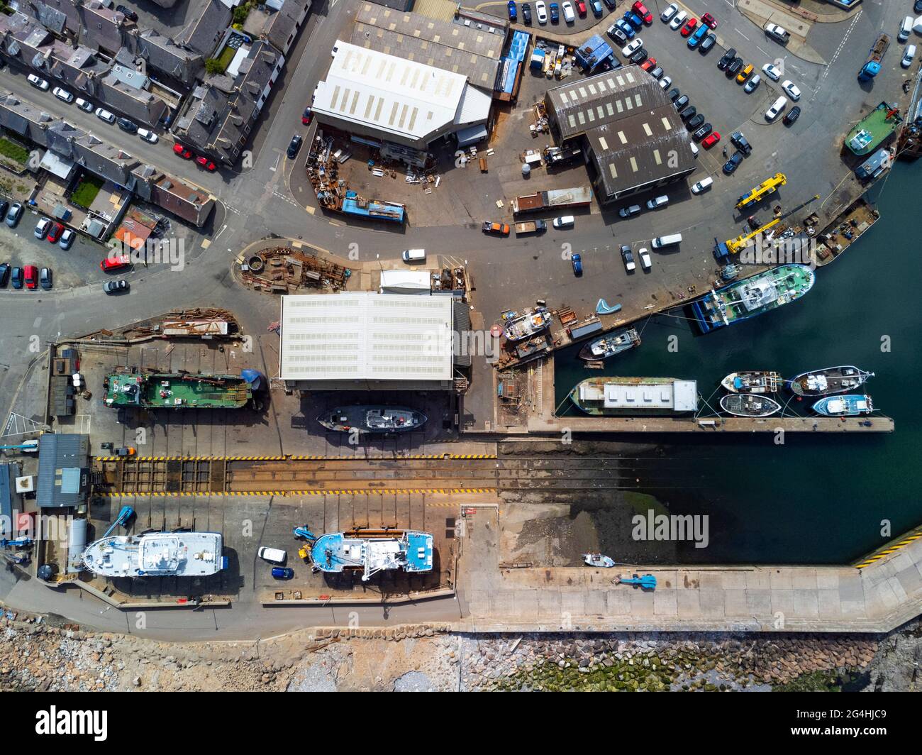 Aerial view from drone of harbour and shipyards at Macduff on Moray Firth coast in Aberdeenshire, Scotland, UK Stock Photo
