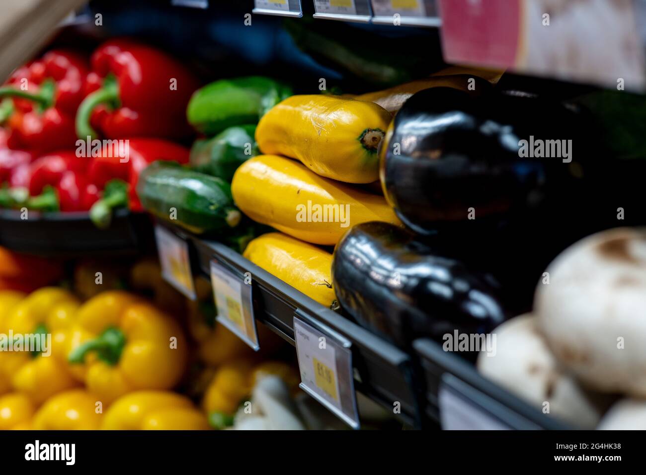 Aubergine or eggplants on sale at a local supermarket. Stock Photo