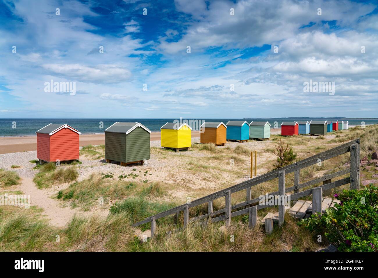 Colourful beach huts on beach at Findhorn in Moray, Morayshire, Scotland, UK Stock Photo