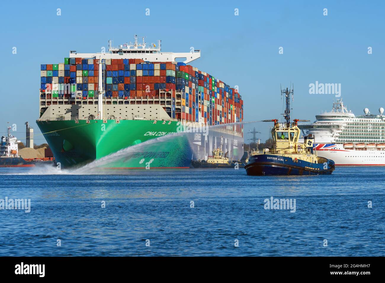 The LNG-powered container ship CMA CGM Jacques Saade gets a tug water ...