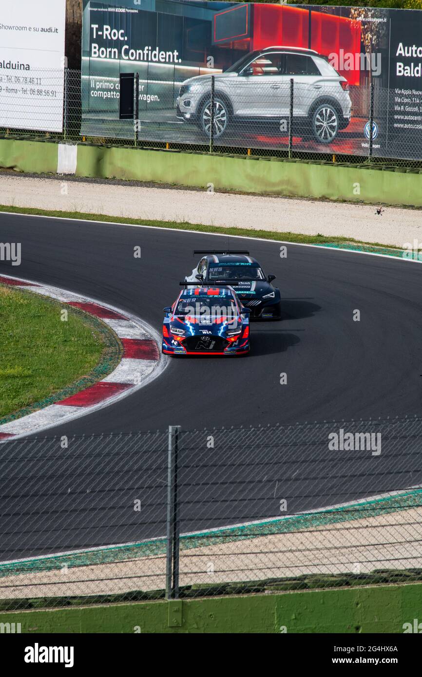 Vallelunga, Italy, June 19 2021, Pure ETCR Championship. Electric cars battle in action racing on asphalt track, Cupra and Hyundai Stock Photo