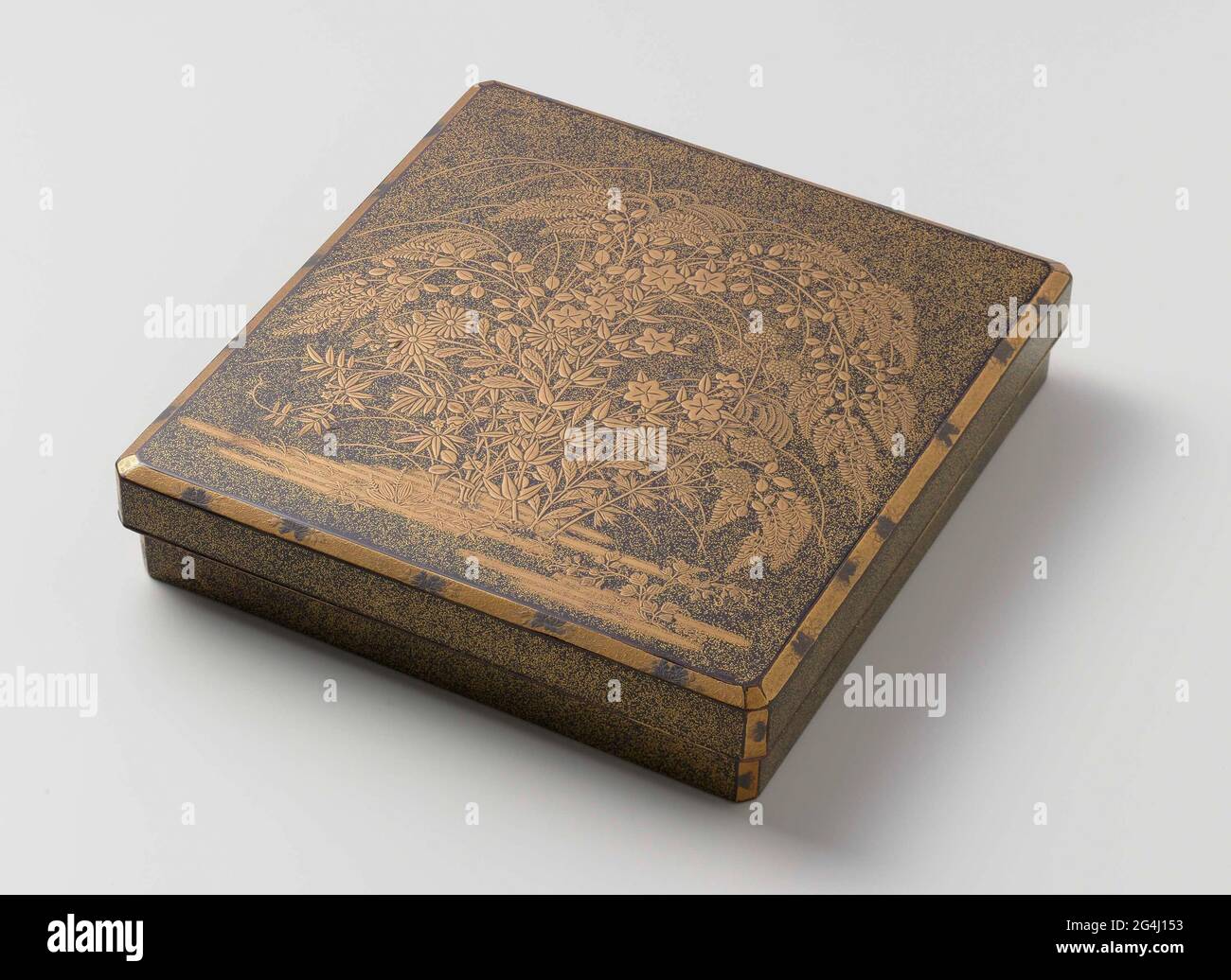 . A bouquet of flowering autumn plants adorns the lid of this box for writing implements, in which a brush and inkstone would have been stored. Japanese lacquerware is decorated with autumnal motifs remarkably often. One explanation may be that autumn in Japan is a pleasant season, when the oppressive heat of summer is replaced by fine, clear weather. Stock Photo