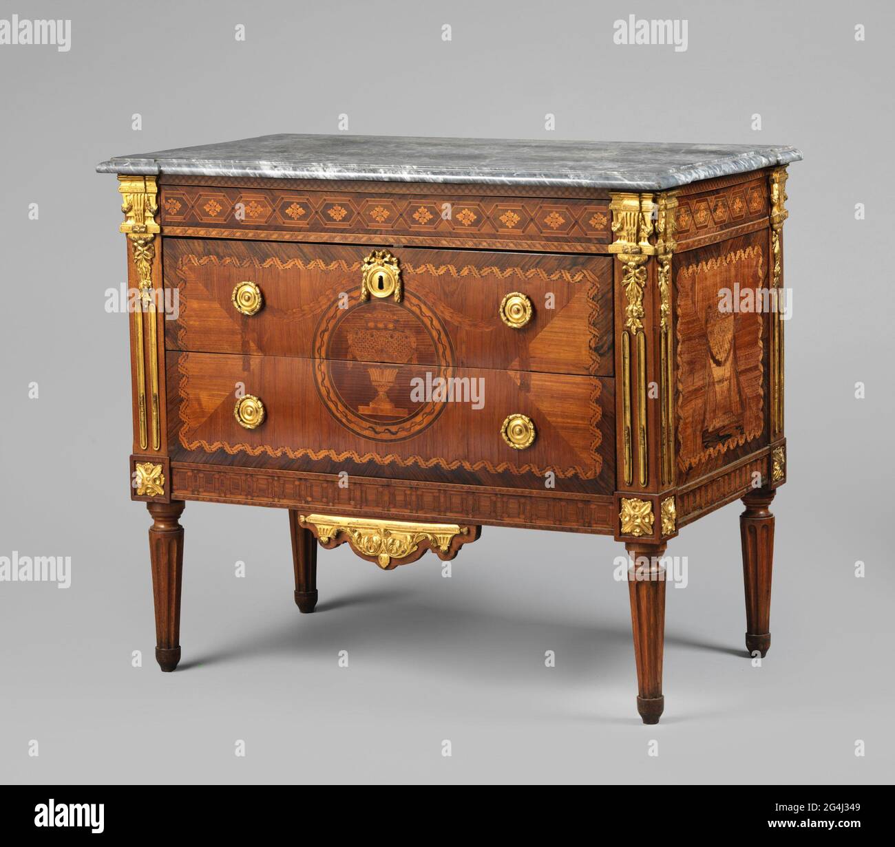 Tea chest with marquetry, Tea chest of oak, glued with marquetry in walnut,  rose, maple, green-stained maple and rosewood, with a decor of stacked  cubes. Copper ball feet and a handle of