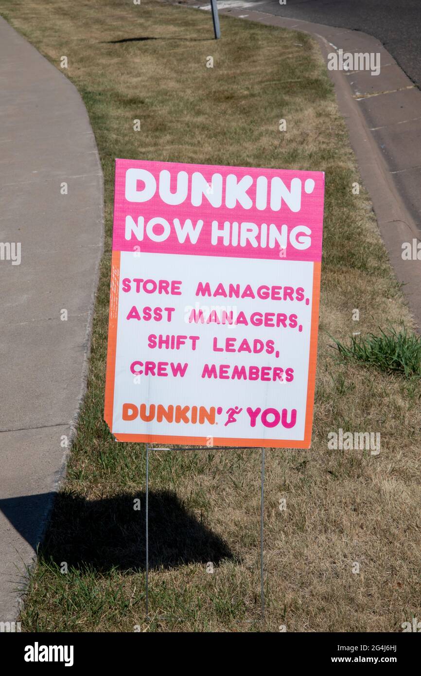 Maplewood, Minnesota.  Now hiring sign at Dunkin Donuts for managers, leads and crew members. Stock Photo