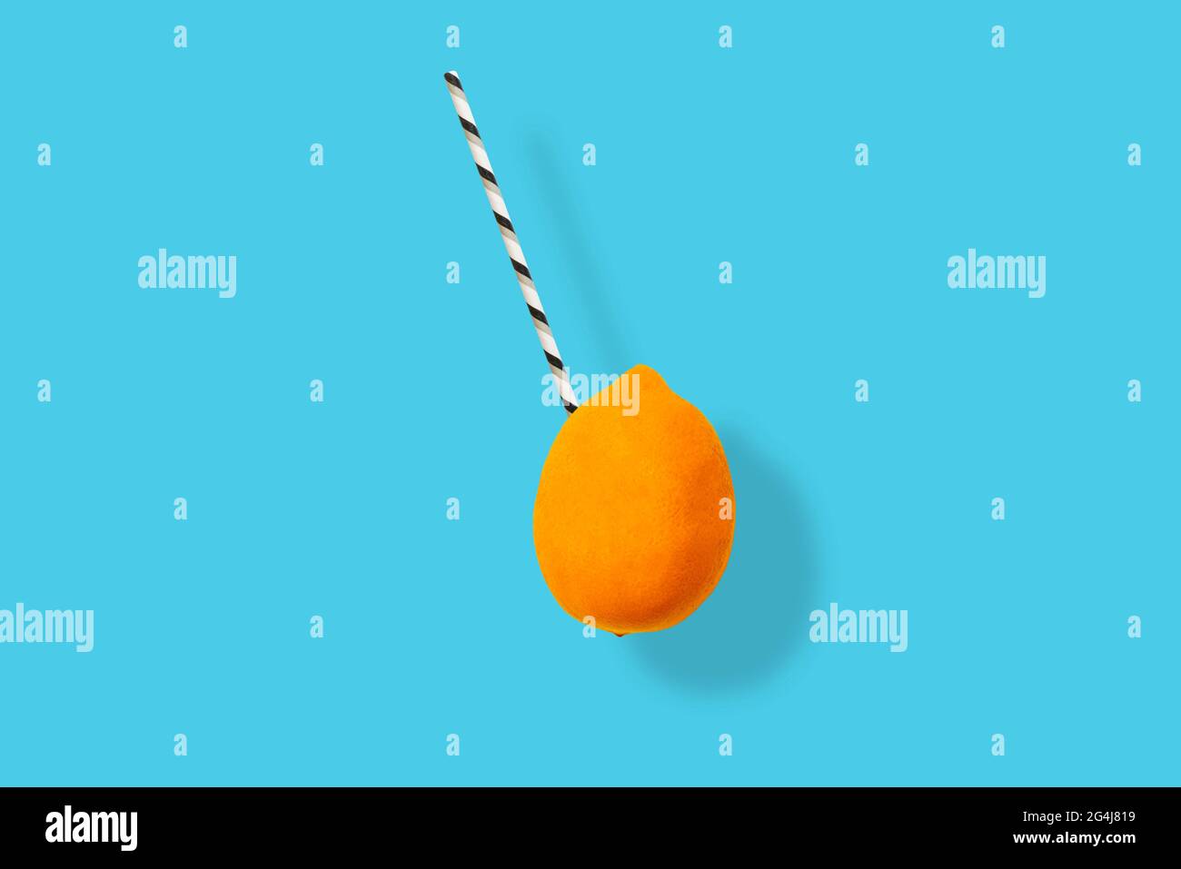 the straw in the raw fresh exotic fruit isolated on colorful background