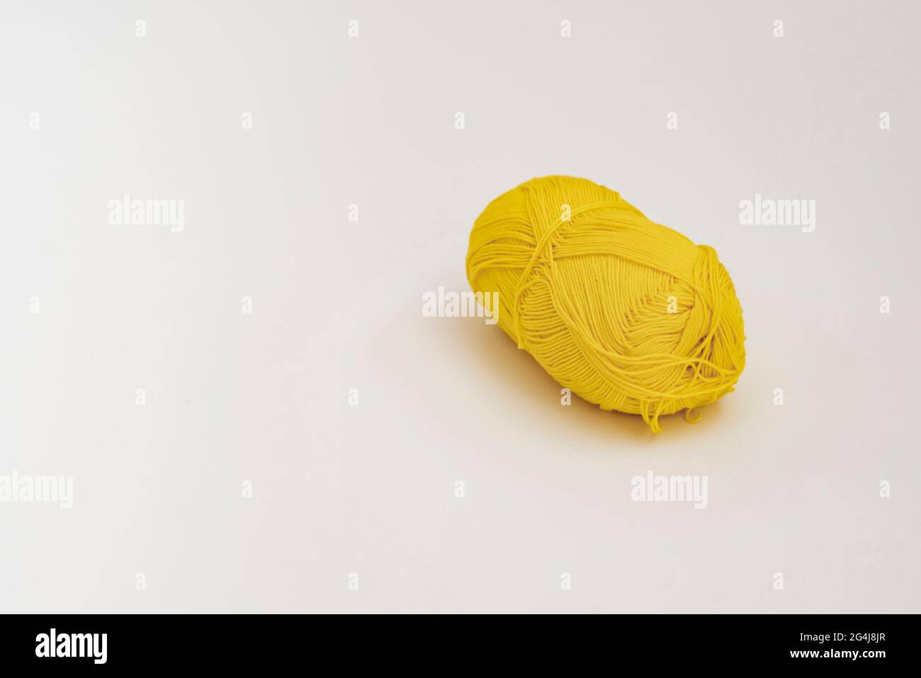 single simple colorful knitting yarn roll float in the air, isolated