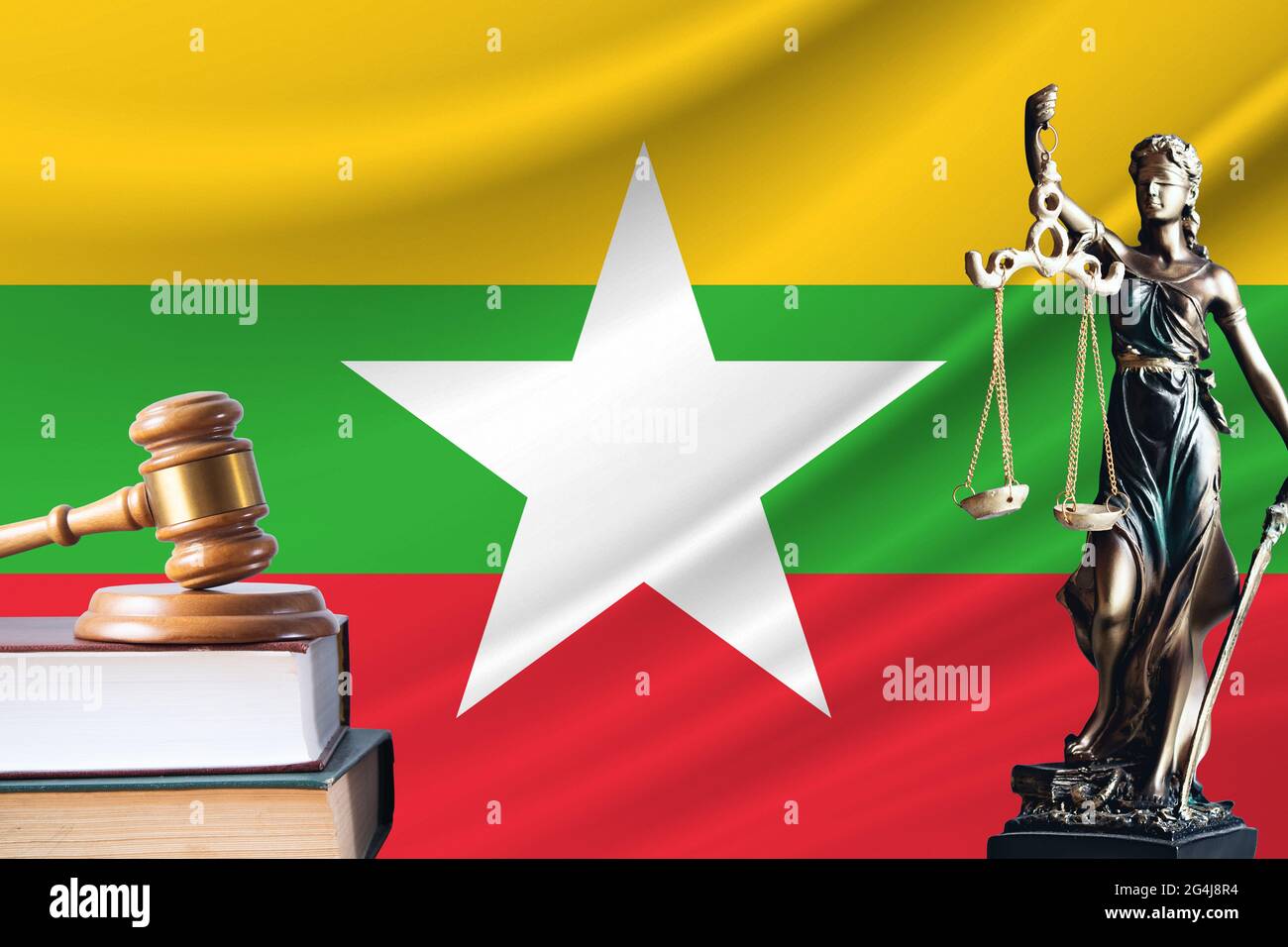 Law and justice in Myanmar. Statue of themis and the gavel of the judge against the background